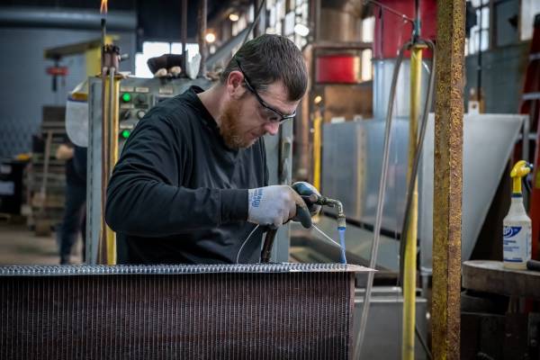Technicians manufacturing aftermarket heat exchange products at an Active Radiator facility