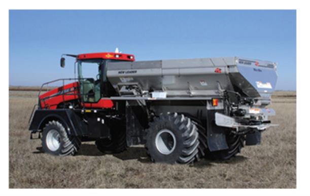 a large agricultural truck in a field